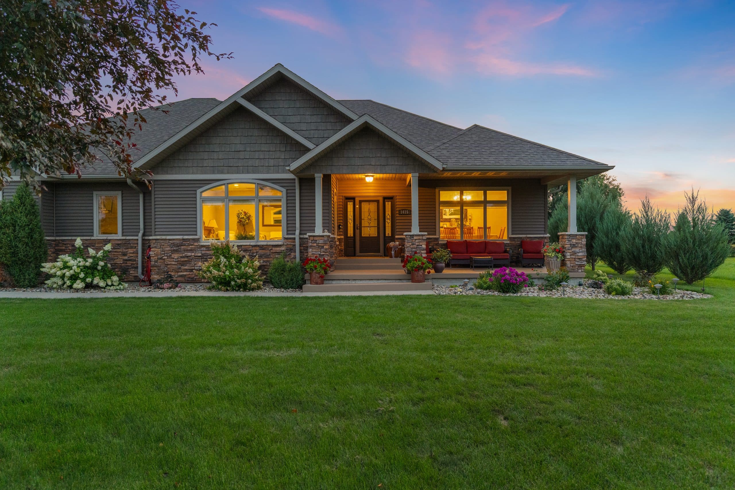 Single-storey home at dusk under a pink evening sky