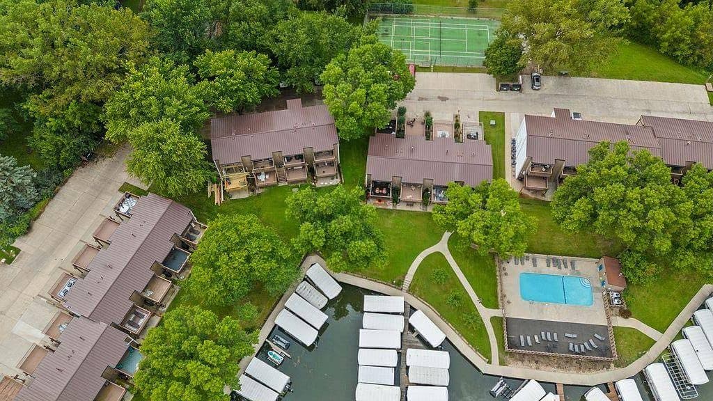 Drone photo of a lakefront property with boat docks on Clear Lake's north shore