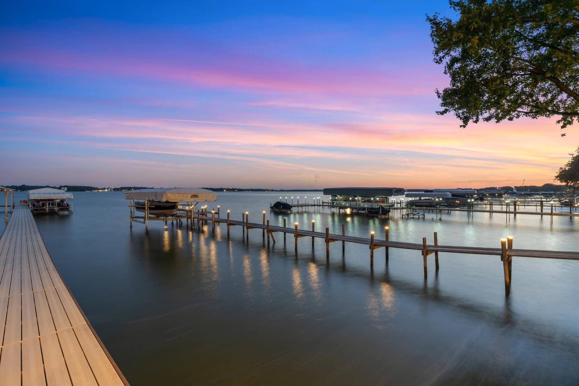 Docks lit up along Clear Lake at sunset