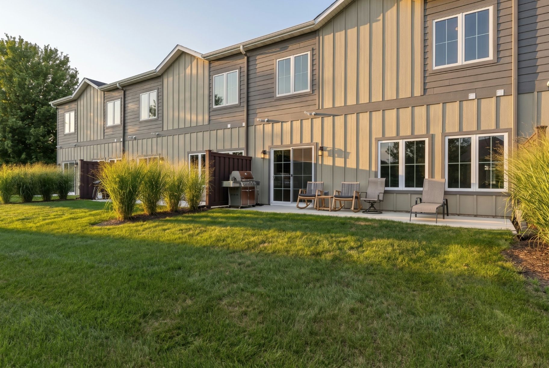 A welcoming duplex patio and balcony at golden hour
