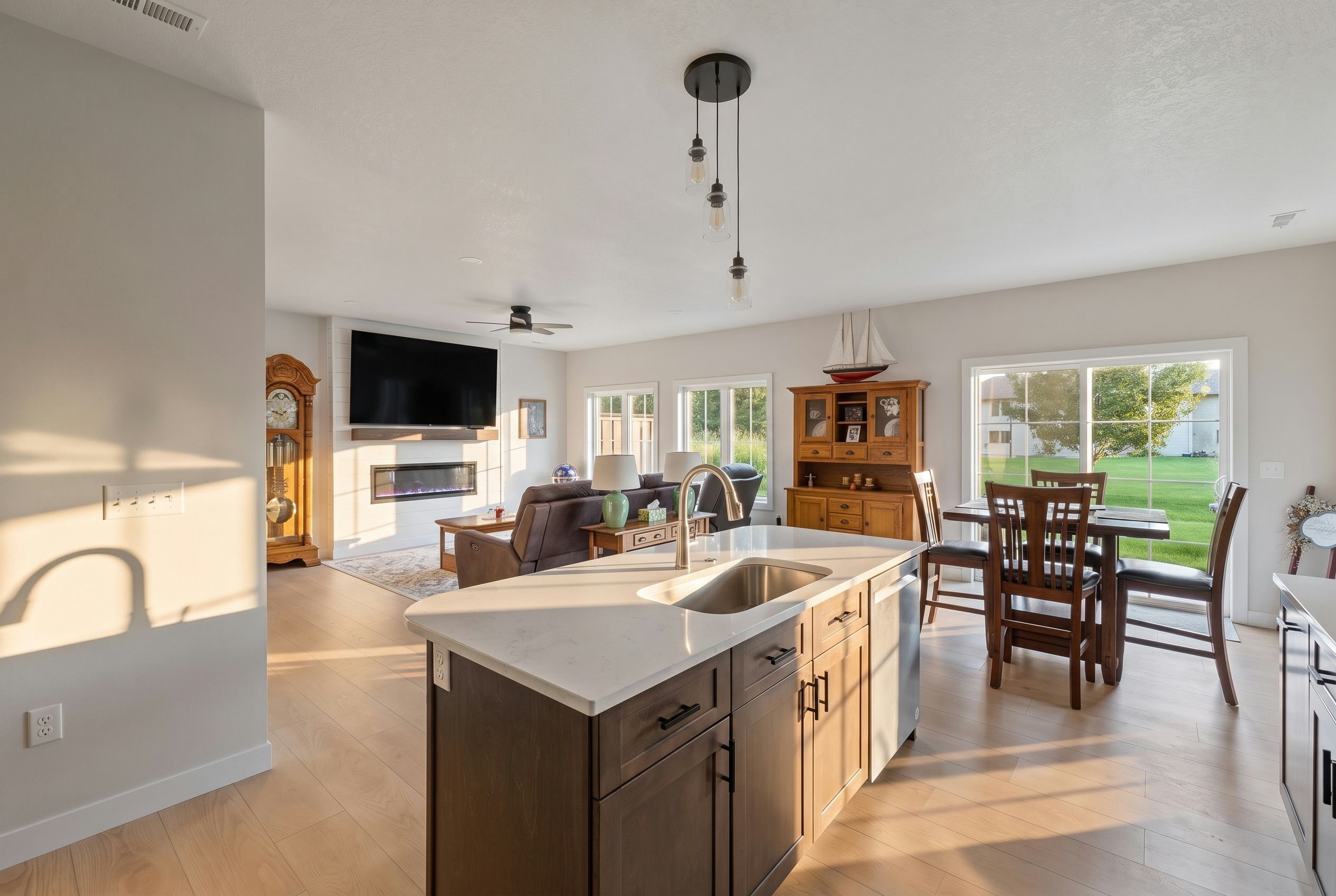 Open-concept Clear Lake interior showing the kitchen flowing into the dining and living areas